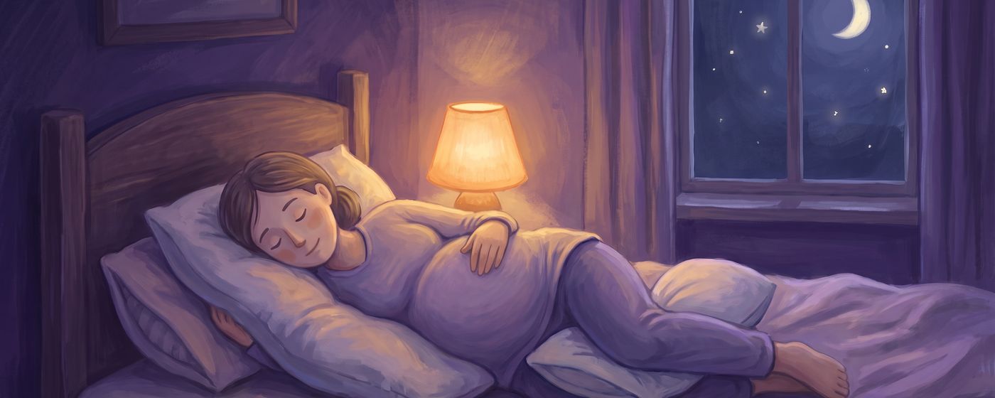 A pregnant woman asleep on her side with a pillow supporting her bump and another between her knees